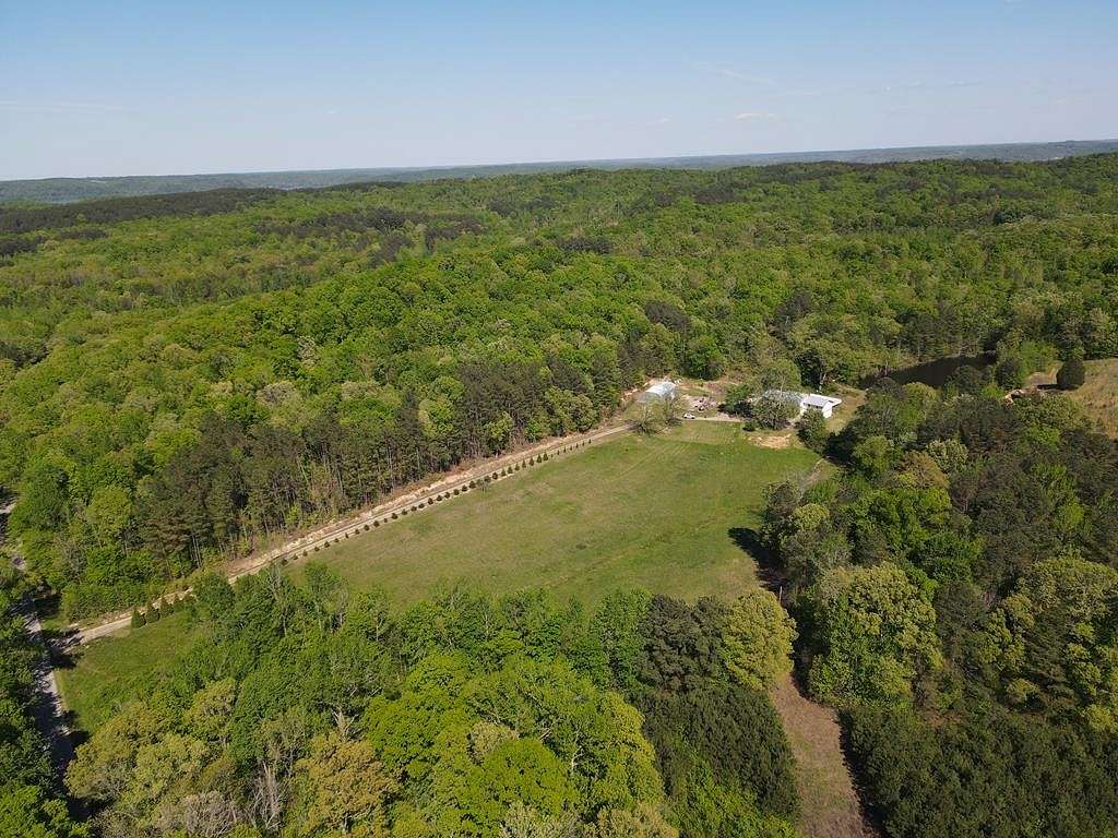 35.36 Acres of Agricultural Land with Home for Sale in Big Sandy, Tennessee