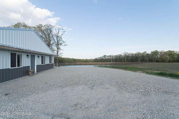 39.5 Acres of Agricultural Land with Home for Sale in Holts Summit, Missouri