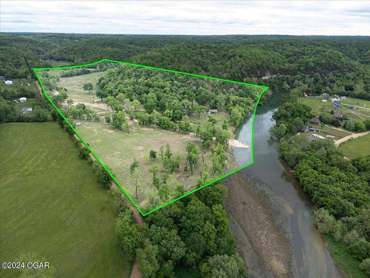 69 Acres of Land with Home for Sale in Pineville, Missouri