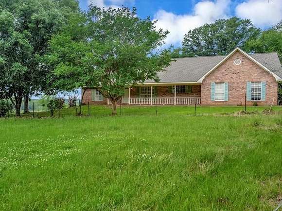 105 Acres of Agricultural Land with Home for Sale in Nacogdoches, Texas