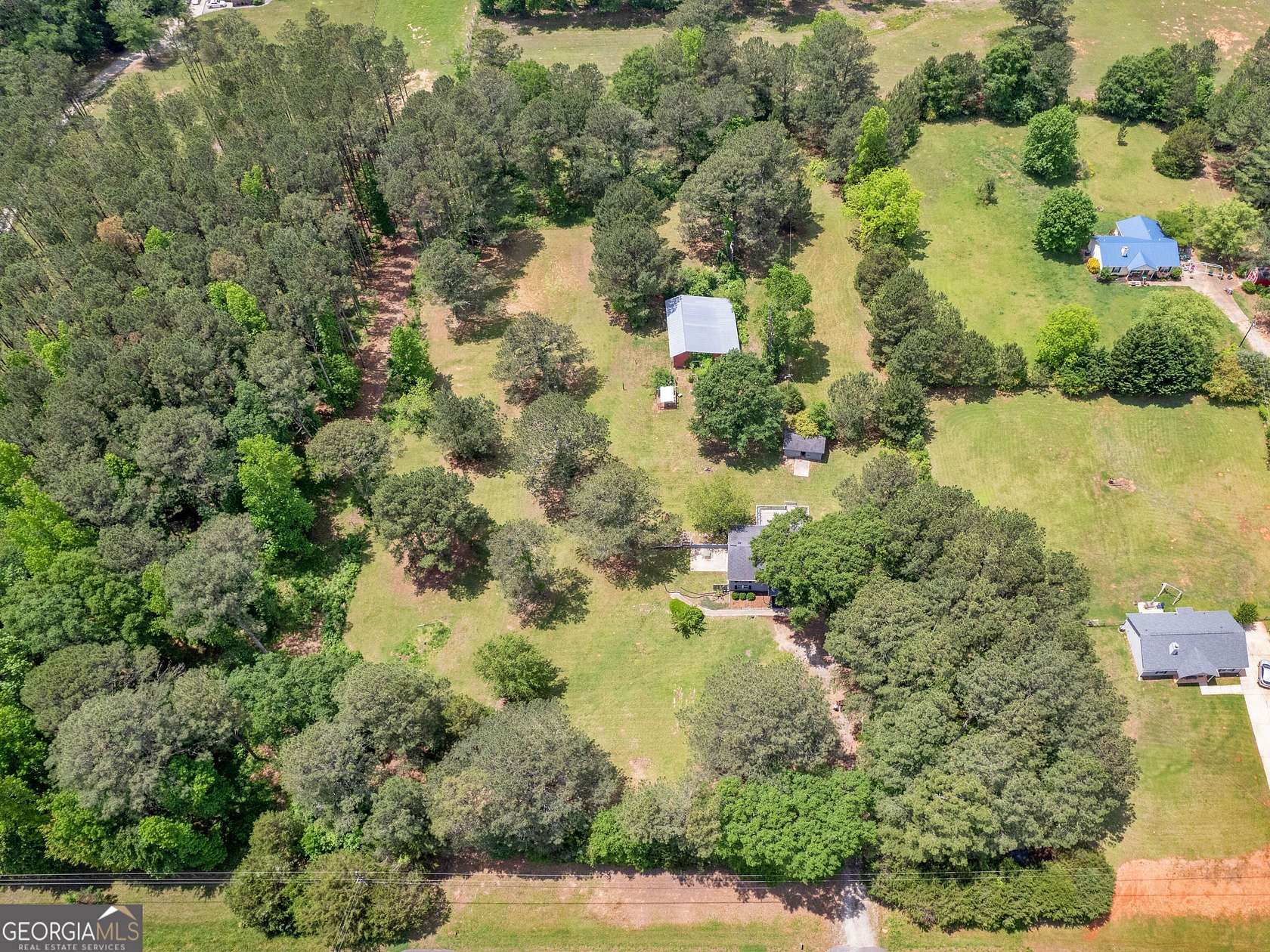 3.9 Acres of Residential Land with Home for Sale in Locust Grove, Georgia