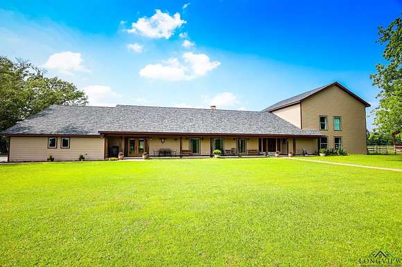 112 Acres of Agricultural Land with Home for Sale in Overton, Texas