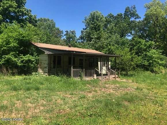 15.9 Acres of Land with Home for Sale in Neosho, Missouri
